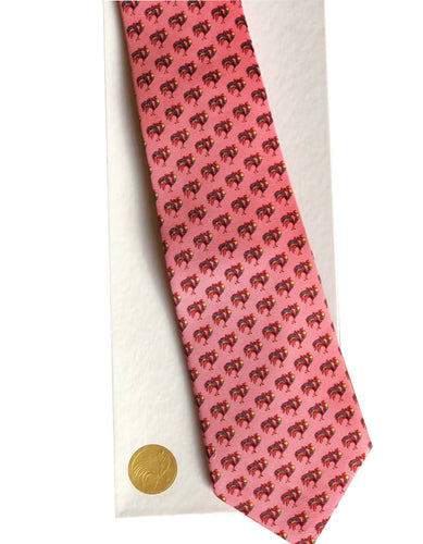 Custom designed pink silk tie by Pelican Coast depicted on white gift box with gold colored seal.